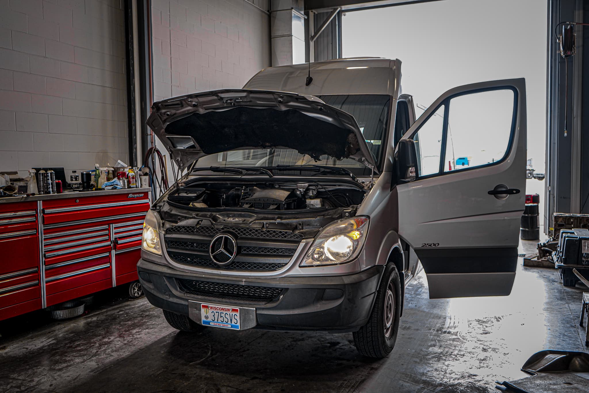 Technician running diesel engine diagnostics